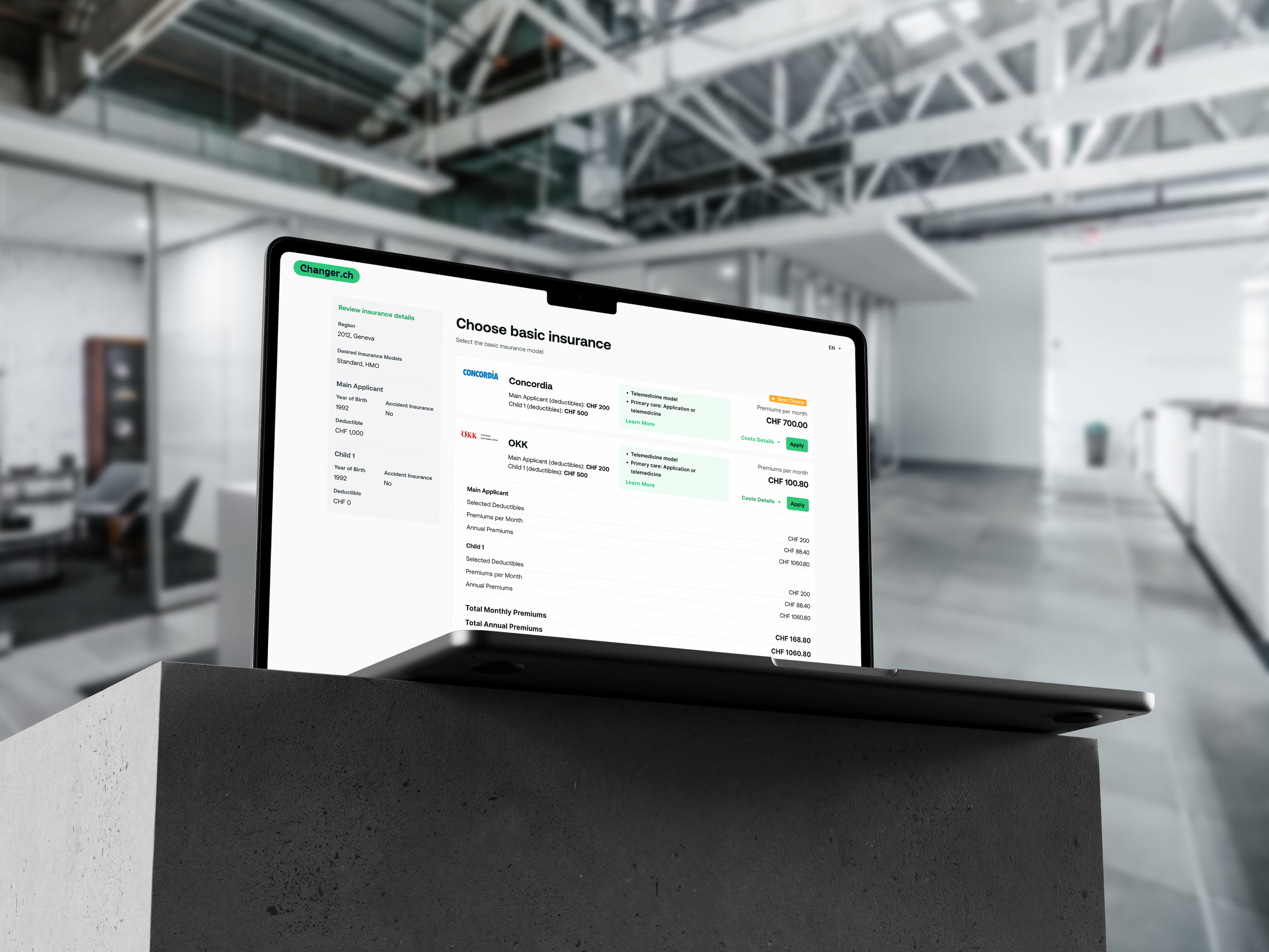 Laptop on a stand with changer form on it